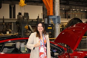 Barbara Albert in front of a Tesla car smallres